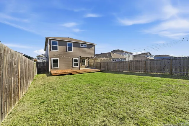 a front view of house with outdoor space and swimming pool
