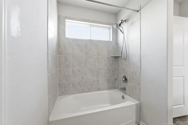 a bathroom with a sink a mirror and a vanity