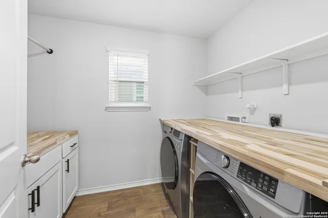a bathroom with a sink toilet and a mirror