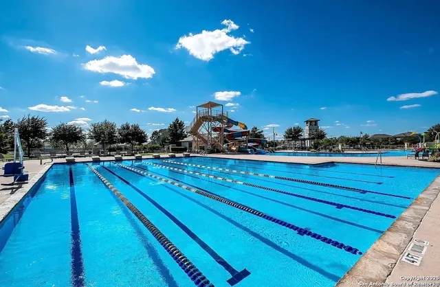a room with lots of potted plants