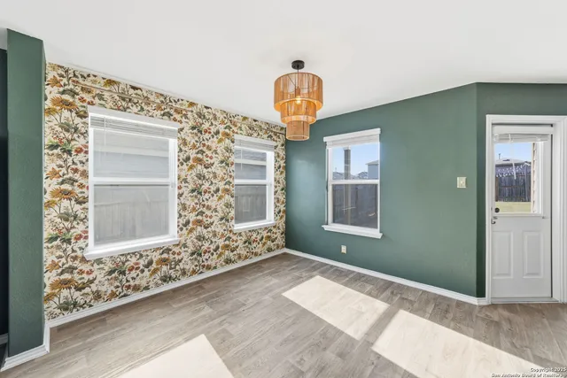 a kitchen with cabinets stainless steel appliances and a counter space