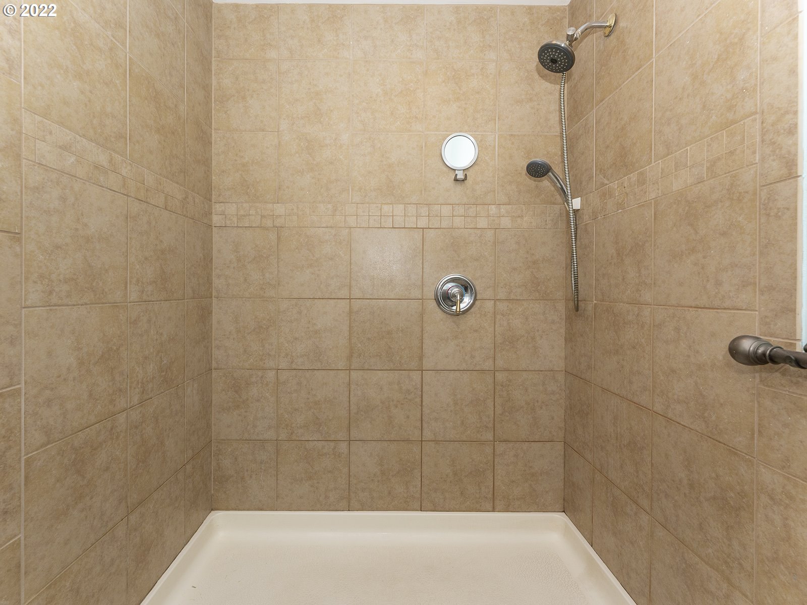23560 Northwest St Helens Road, Unit N4 Portland, OR 97231 - Photo 22 of 27 a bathroom with a shower and a bathtub