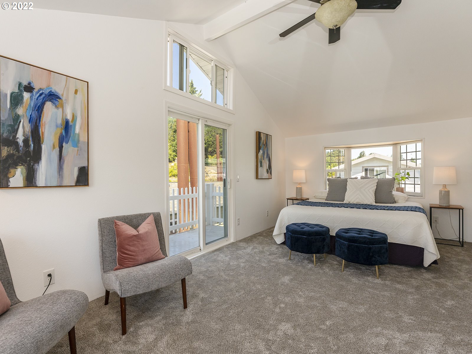 23560 Northwest St Helens Road, Unit N4 Portland, OR 97231 - Photo 24 of 27 a spacious bedroom with a bed and a couch