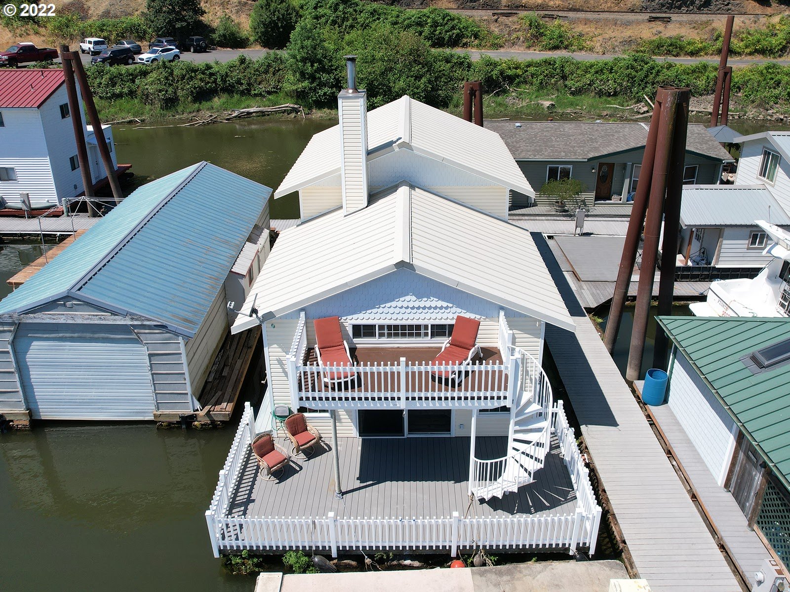 23560 Northwest St Helens Road, Unit N4 Portland, OR 97231 - Photo 3 of 27 a front view of a house with a yard