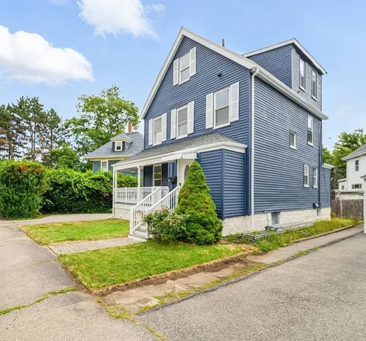 front view of a house with a yard
