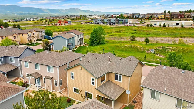 an aerial view of a house with a garden