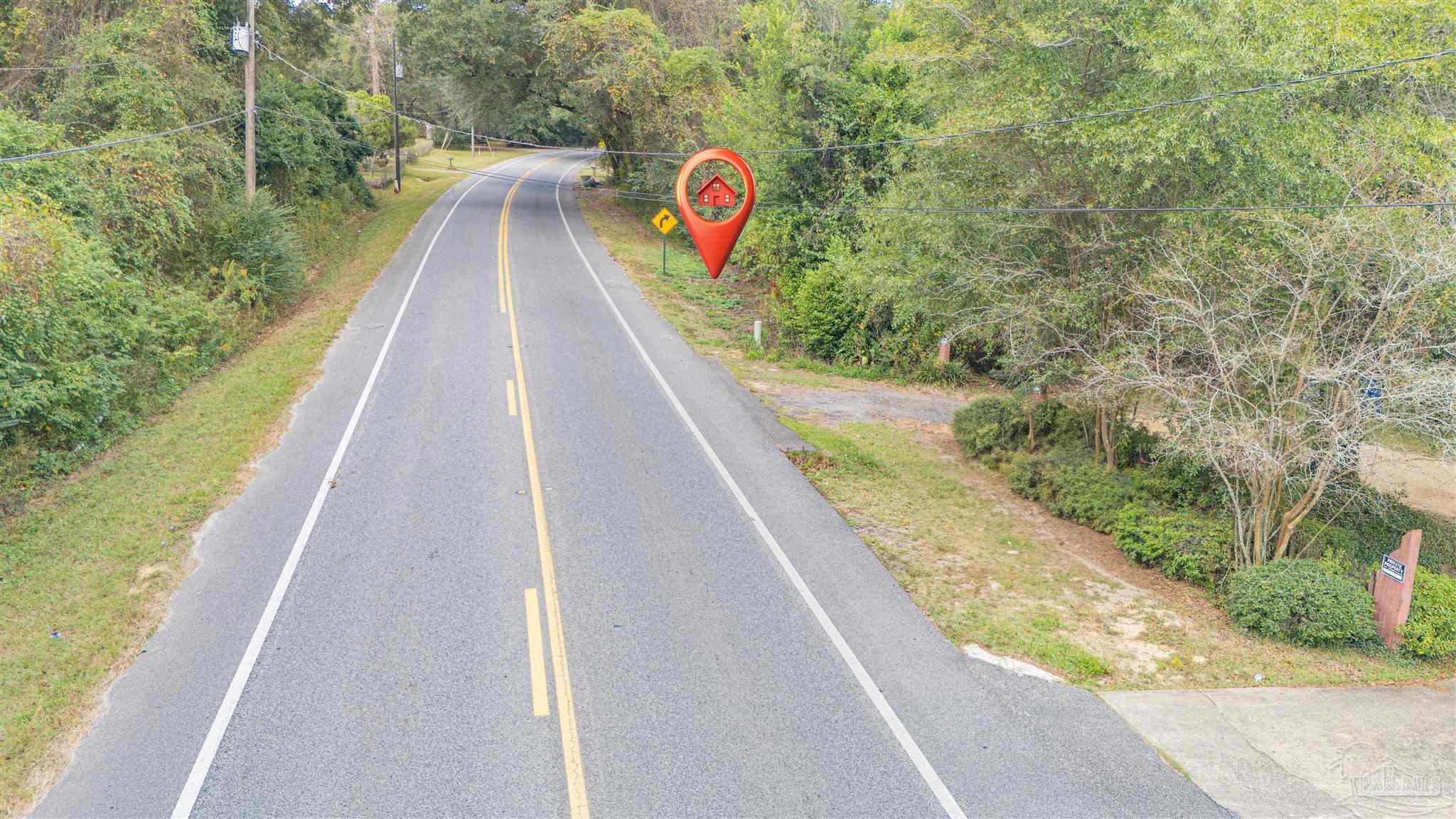 2290 Old Chemstrand Road Cantonment, FL 32533 - Photo 14 of 17 a view of swimming pool with a balcony