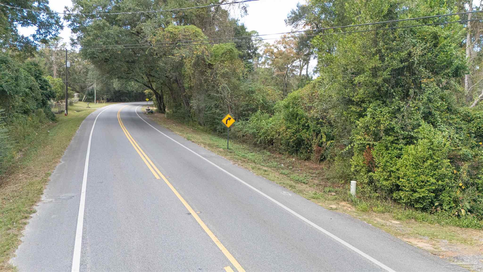 2290 Old Chemstrand Road Cantonment, FL 32533 - Photo 15 of 17 a view of a balcony with yard