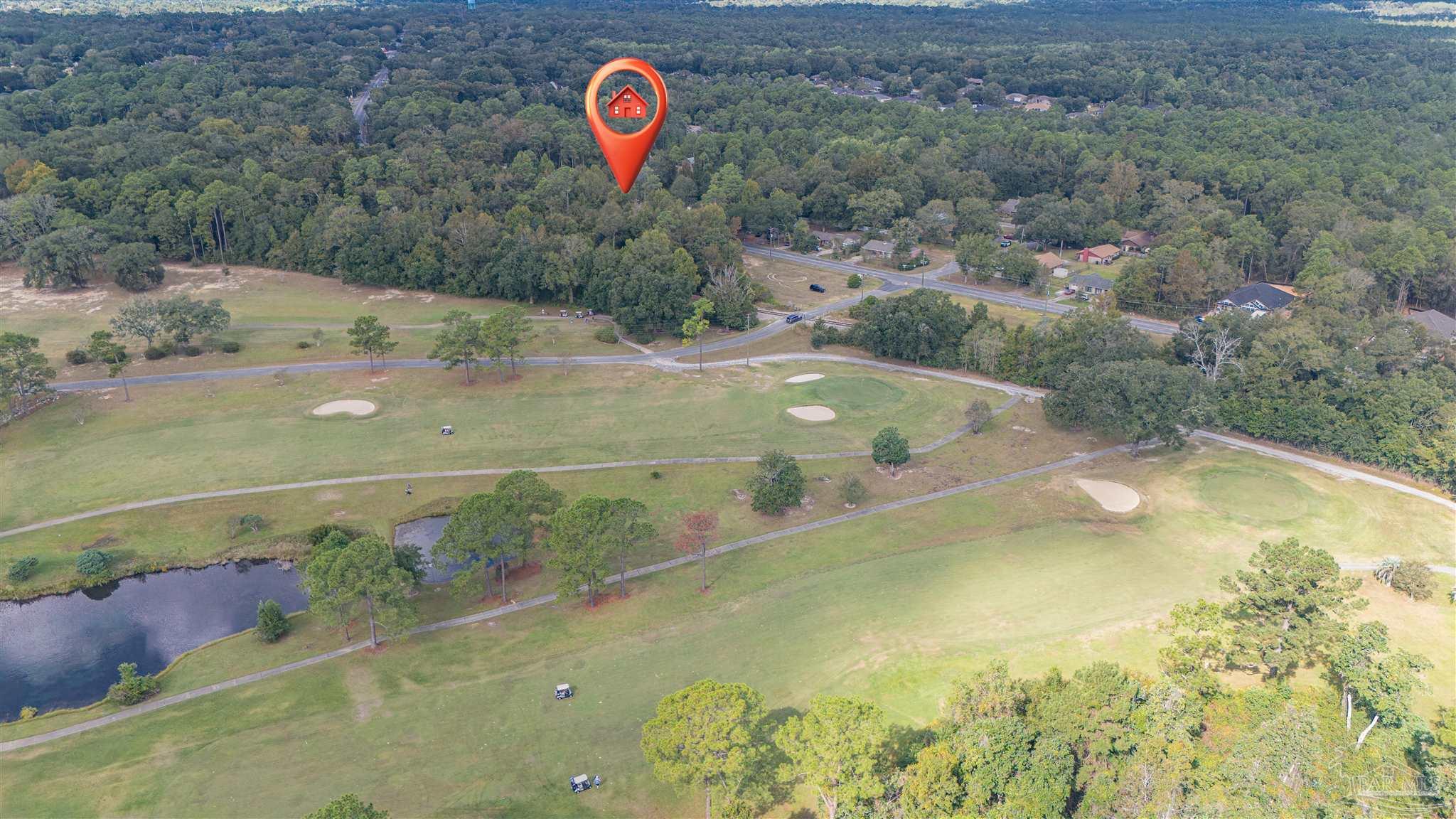 2290 Old Chemstrand Road Cantonment, FL 32533 - Photo 5 of 17 a view of a swimming pool with a yard