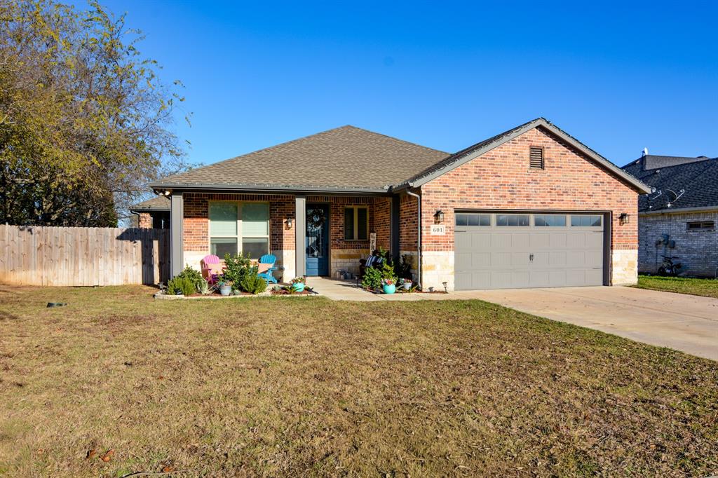 601 Mathew Street Grandview, TX 76050 - Photo 1 of 40 a view of a house with a yard and garage