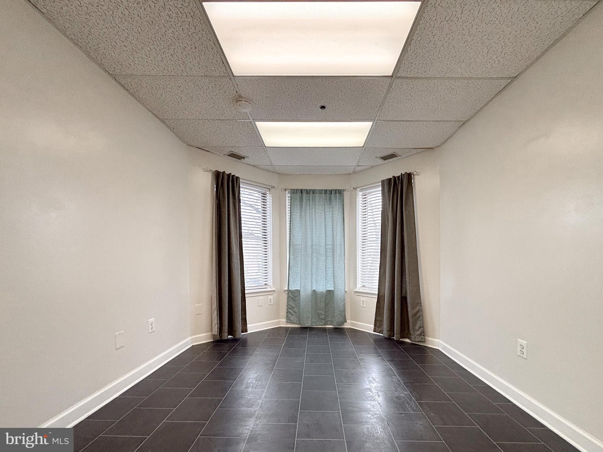657 A Main Street, Unit A Laurel, MD 20707 - Photo 14 of 25 an empty room with windows and closet