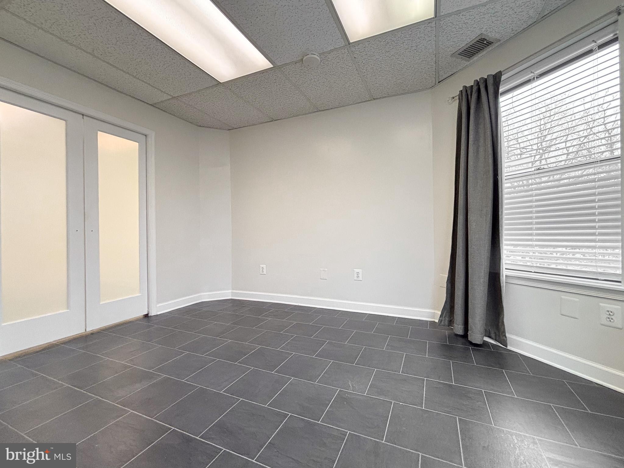 657 A Main Street, Unit A Laurel, MD 20707 - Photo 18 of 25 a view of an empty room and window