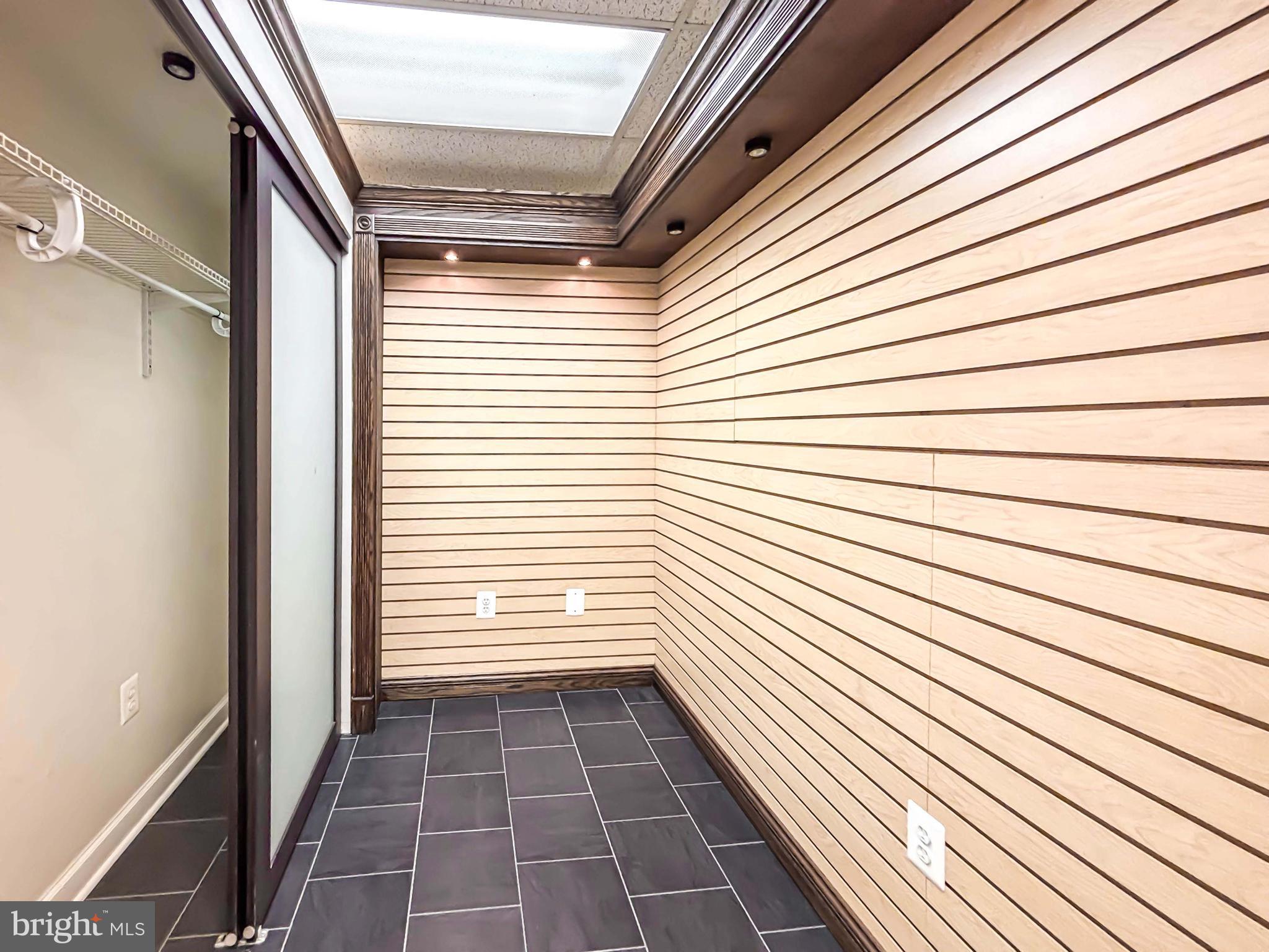 657 A Main Street, Unit A Laurel, MD 20707 - Photo 22 of 25 a view of a balcony with wooden floor and white door
