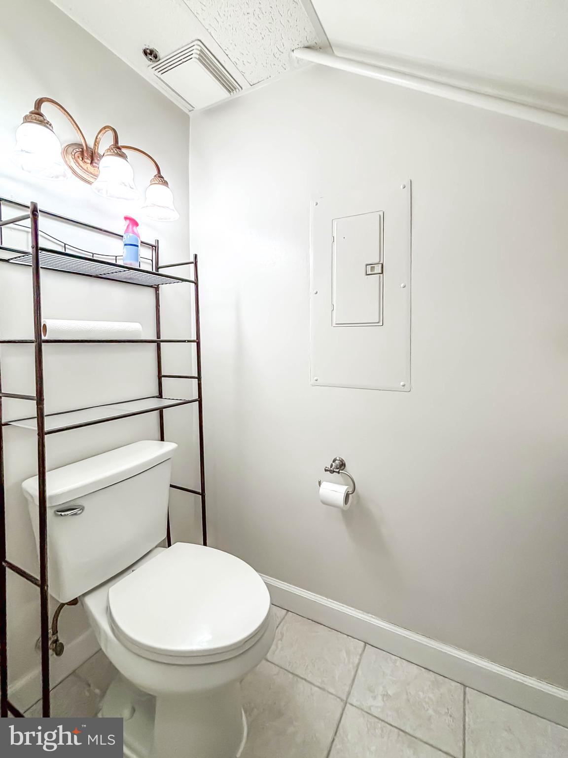 657 A Main Street, Unit A Laurel, MD 20707 - Photo 25 of 25 a bathroom with a toilet and a shower