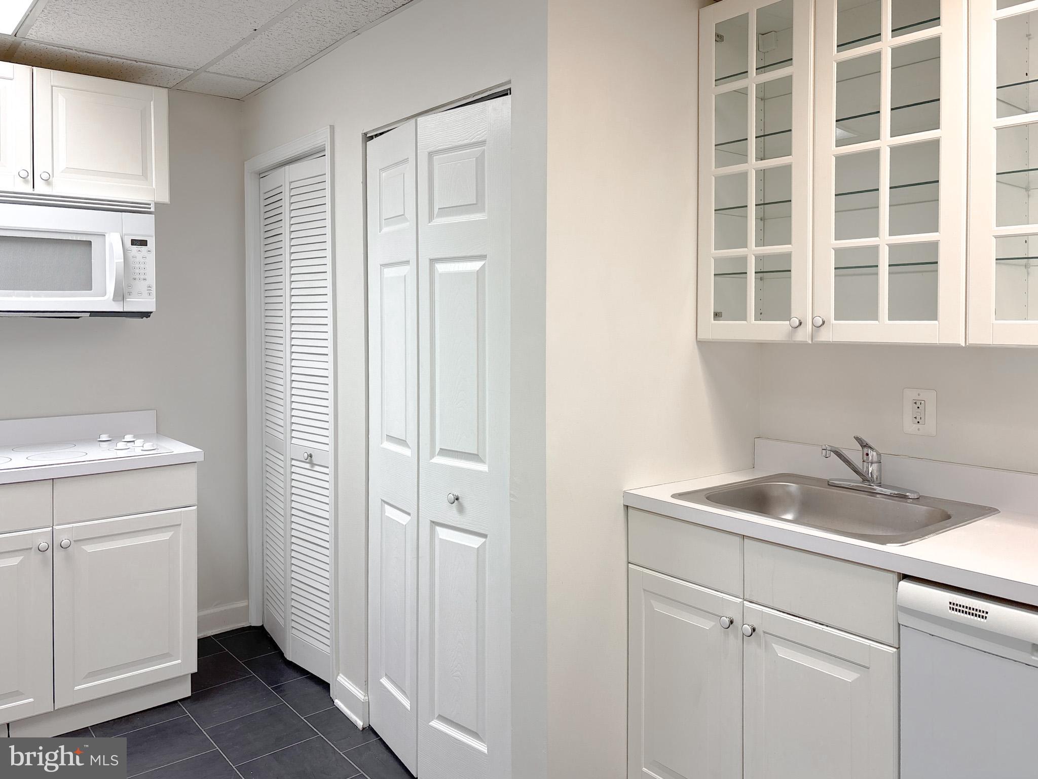 657 A Main Street, Unit A Laurel, MD 20707 - Photo 5 of 25 a bathroom with a sink and a toilet