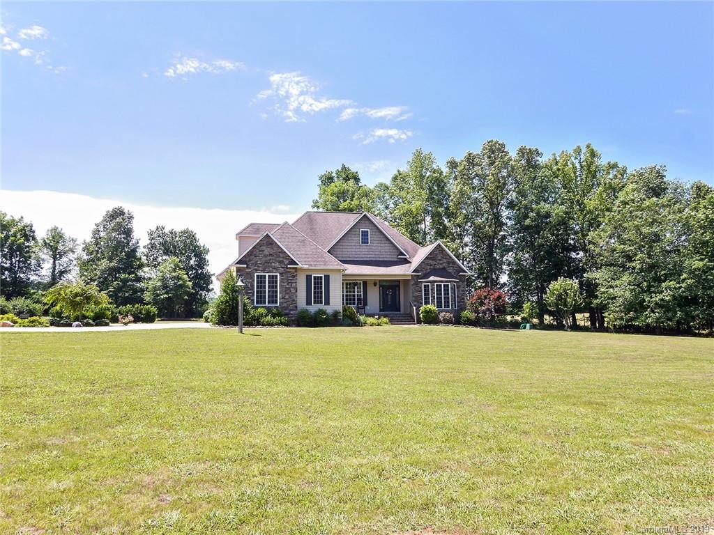 4657 Hickory Grove Road Sharon, SC 29742 - Photo 2 of 32 a front view of a house with a yard and trees