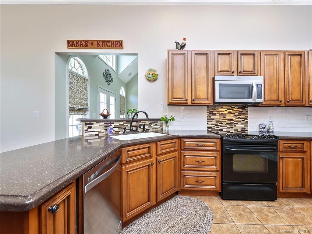 4657 Hickory Grove Road Sharon, SC 29742 - Photo 11 of 32 a kitchen with stainless steel appliances granite countertop a stove and a sink