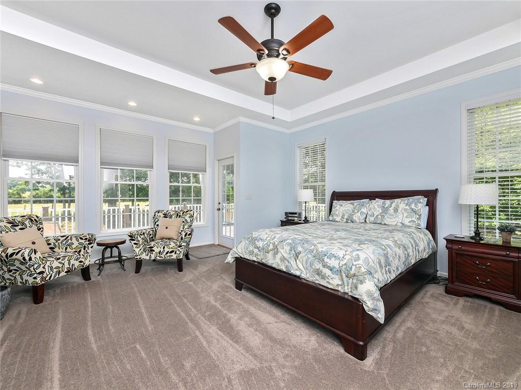 4657 Hickory Grove Road Sharon, SC 29742 - Photo 15 of 32 a spacious bedroom with a bed and a couch