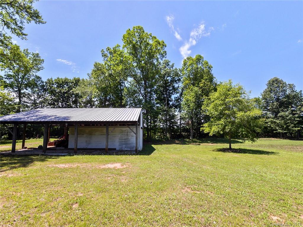 4657 Hickory Grove Road Sharon, SC 29742 - Photo 27 of 32 a house with swimming pool in front of it