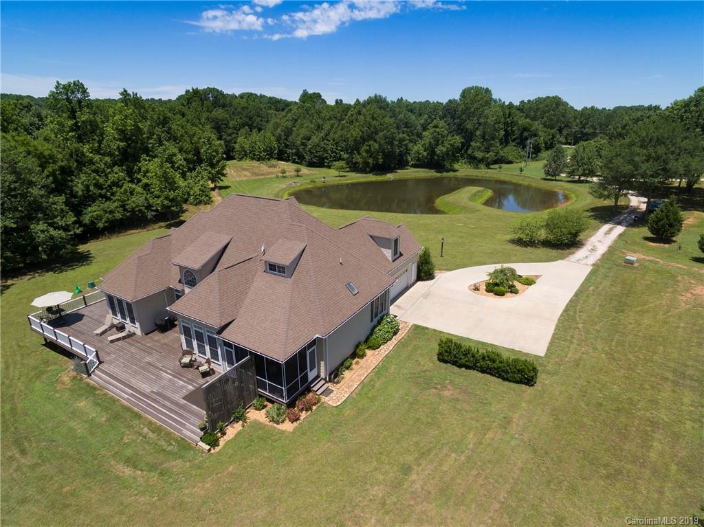 4657 Hickory Grove Road Sharon, SC 29742 - Photo 4 of 32 a view of a lake with a yard