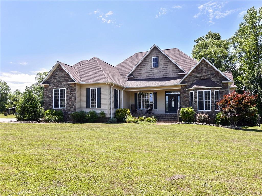 4657 Hickory Grove Road Sharon, SC 29742 - Photo 5 of 32 a front view of a house with a yard and garage