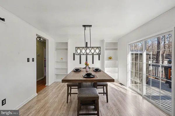 a kitchen with stainless steel appliances granite countertop a stove and cabinets