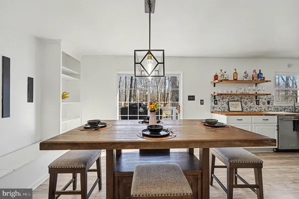 a kitchen with stainless steel appliances a refrigerator sink and cabinets