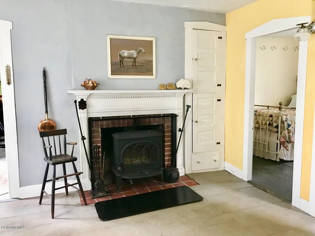 170 Stetson Brothers Road Colrain, MA 01340 - Photo 14 of 30 a living room with furniture and a fireplace