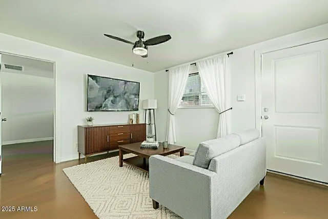 a living room with furniture and a window