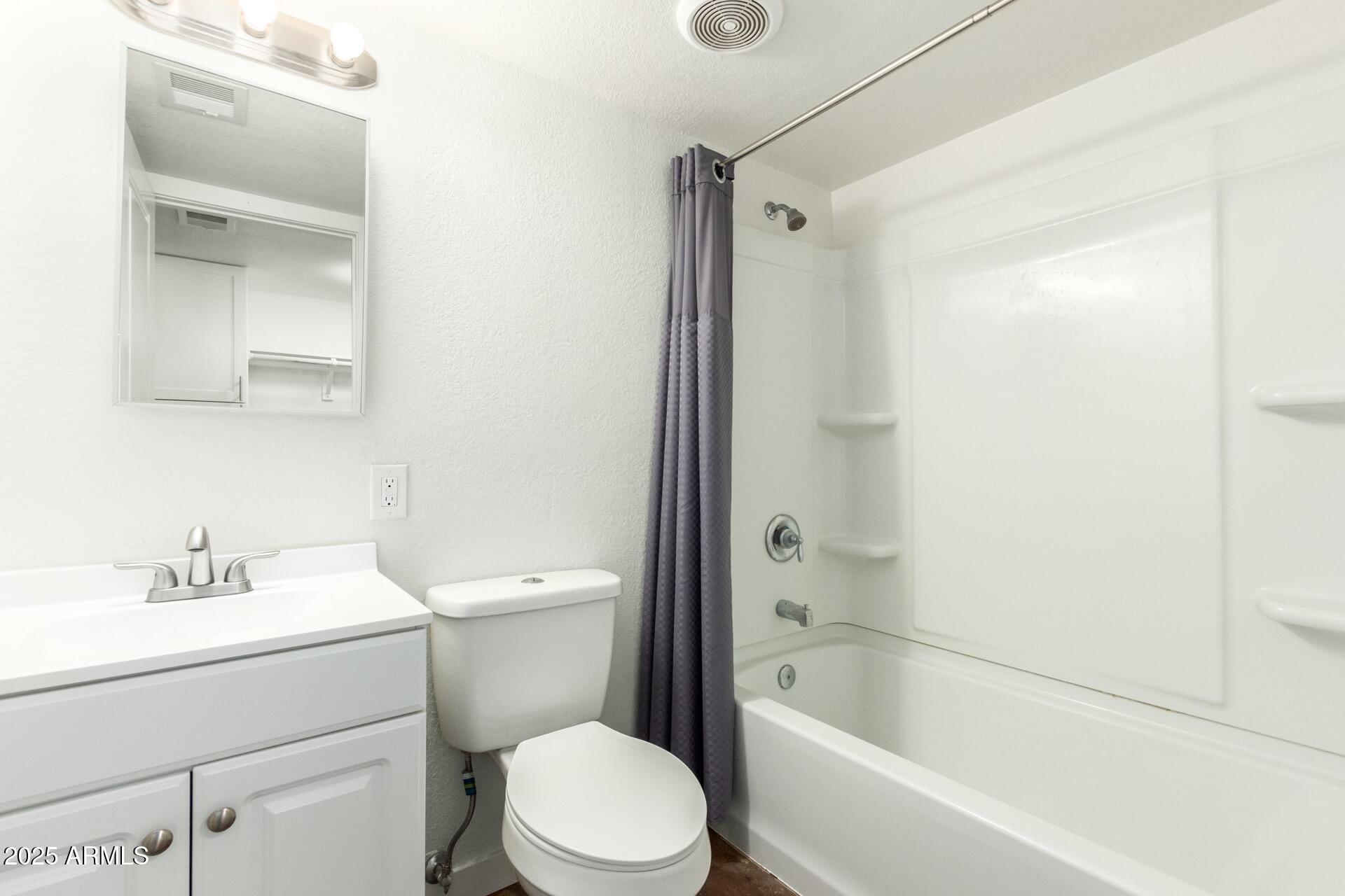 616 South Bellview, Unit C Mesa, AZ 85204 - Photo 11 of 19 a bathroom with a sink toilet and shower
