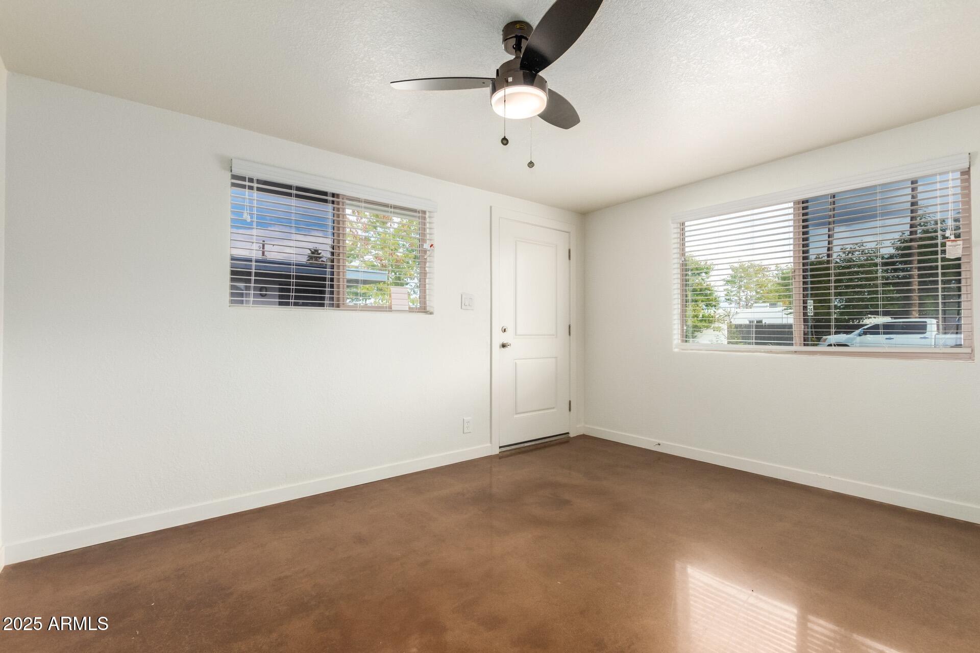 616 South Bellview, Unit C Mesa, AZ 85204 - Photo 5 of 19 a view of an empty room with a window