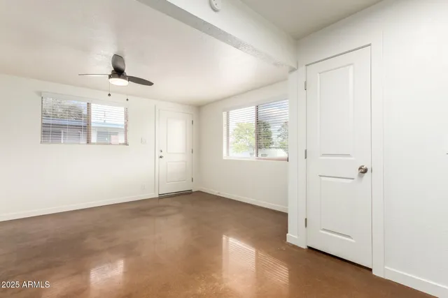 a view of an empty room with a window