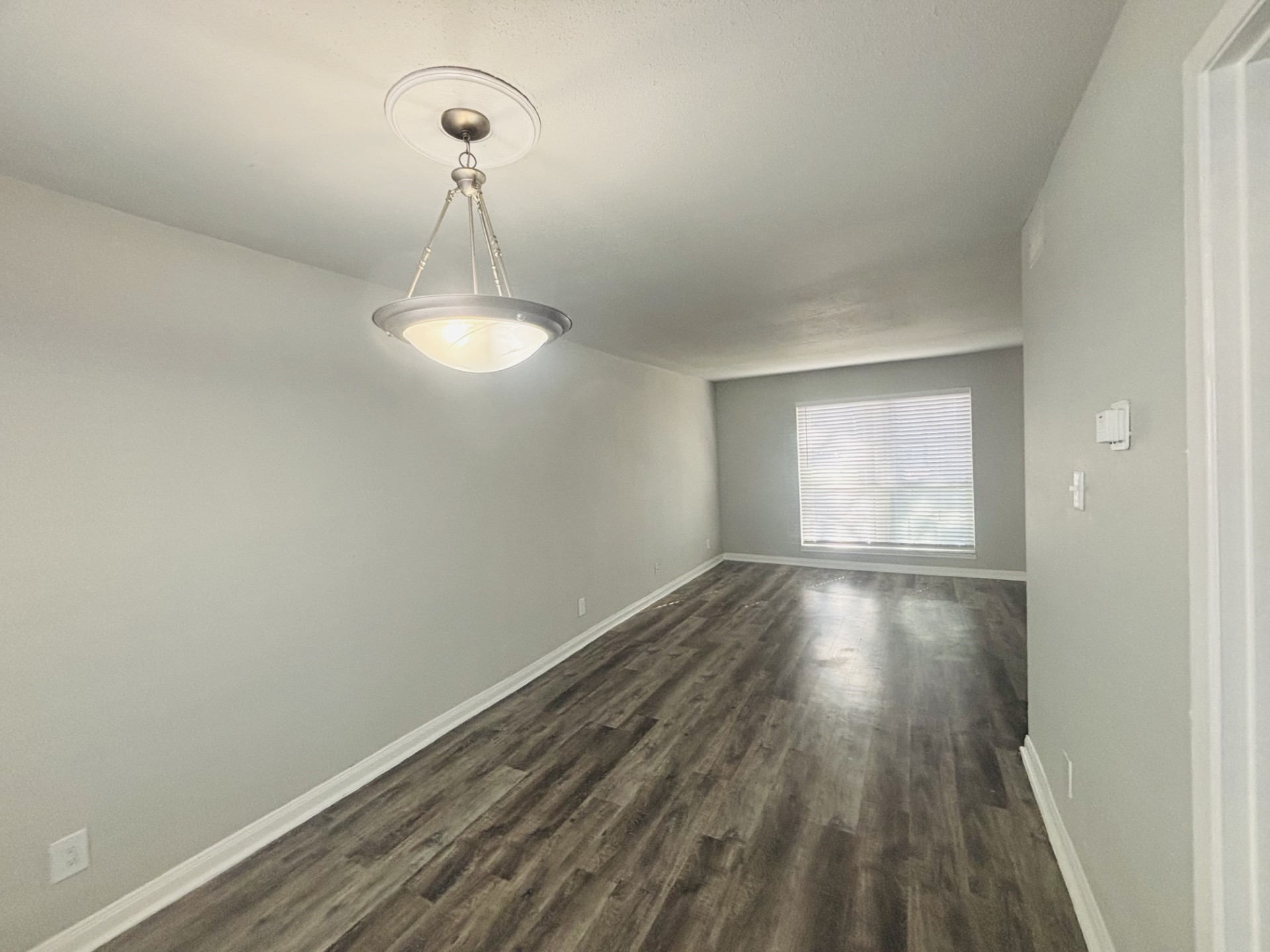 6200 West Tidwell Road, Unit 1109 Houston, TX 77092 - Photo 7 of 18 a view of a room with wooden floor lounge chair and windows