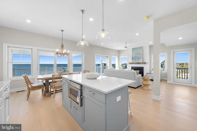 a view of a dining room with furniture wooden floor and chandelier