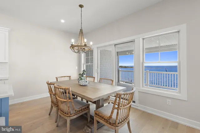 a bathroom with a toilet a sink a mirror and a shower