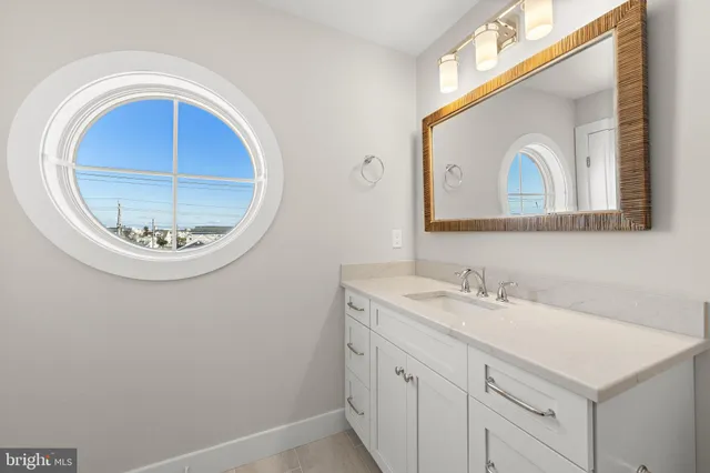 a bedroom with a bed and a bathroom