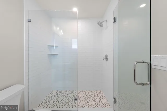 a view of a dining room with furniture a chandelier and wooden floor