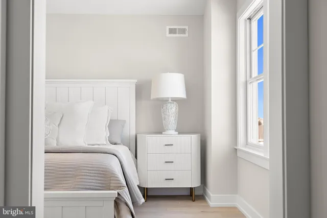 a view of a balcony with wooden floor and fence