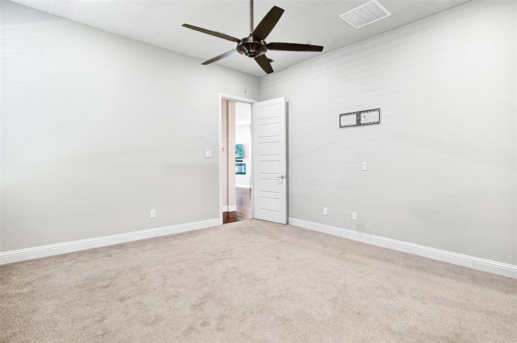 468 Caitlyn Way Fairview, TX 75069 - Photo 19 of 35 Empty room with carpet and a ceiling fan