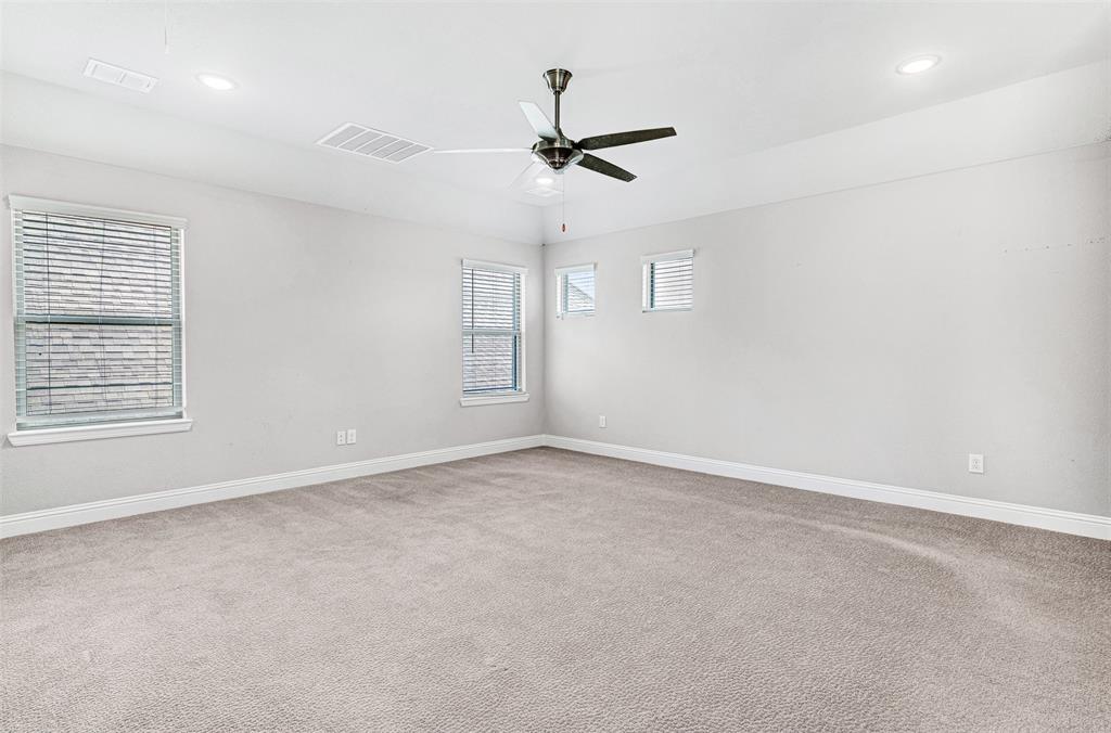 468 Caitlyn Way Fairview, TX 75069 - Photo 27 of 35 Empty room featuring light colored carpet, recessed lighting, and ceiling fan