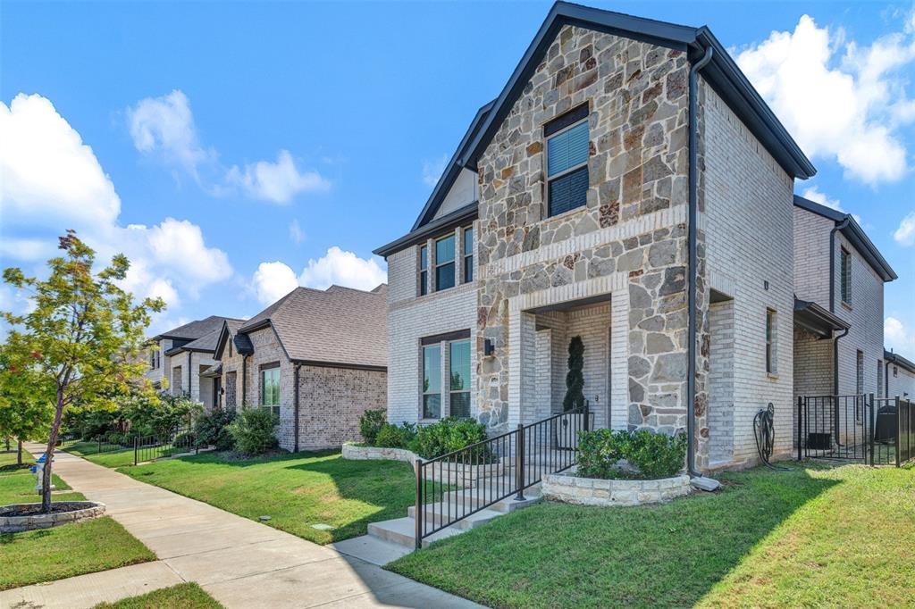 468 Caitlyn Way Fairview, TX 75069 - Photo 3 of 35 View of front facade featuring stone siding, a front lawn, and brick siding