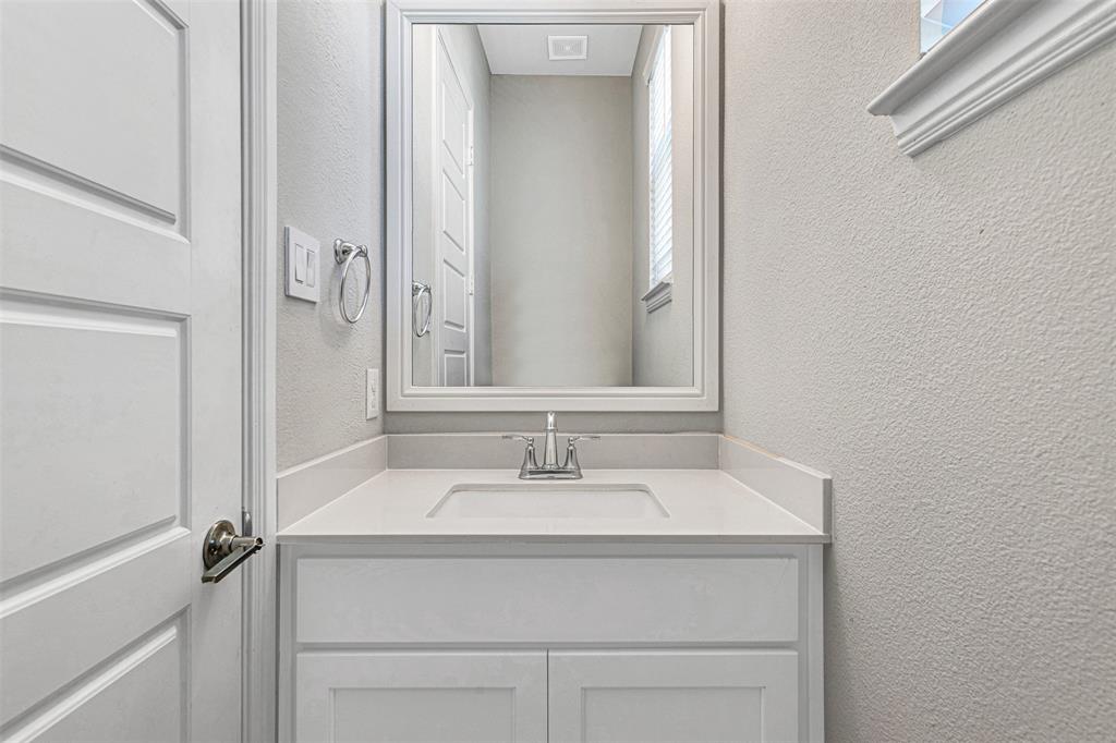 468 Caitlyn Way Fairview, TX 75069 - Photo 6 of 35 Bathroom with a textured wall and vanity