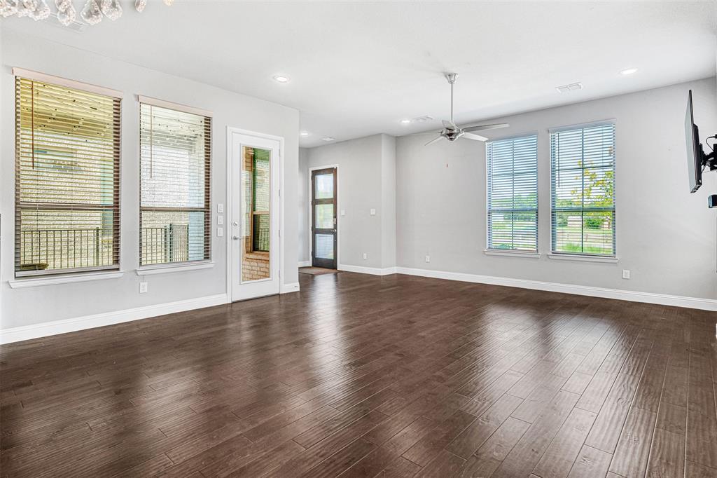 468 Caitlyn Way Fairview, TX 75069 - Photo 9 of 35 Unfurnished room featuring a ceiling fan, dark wood-style floors, and recessed lighting