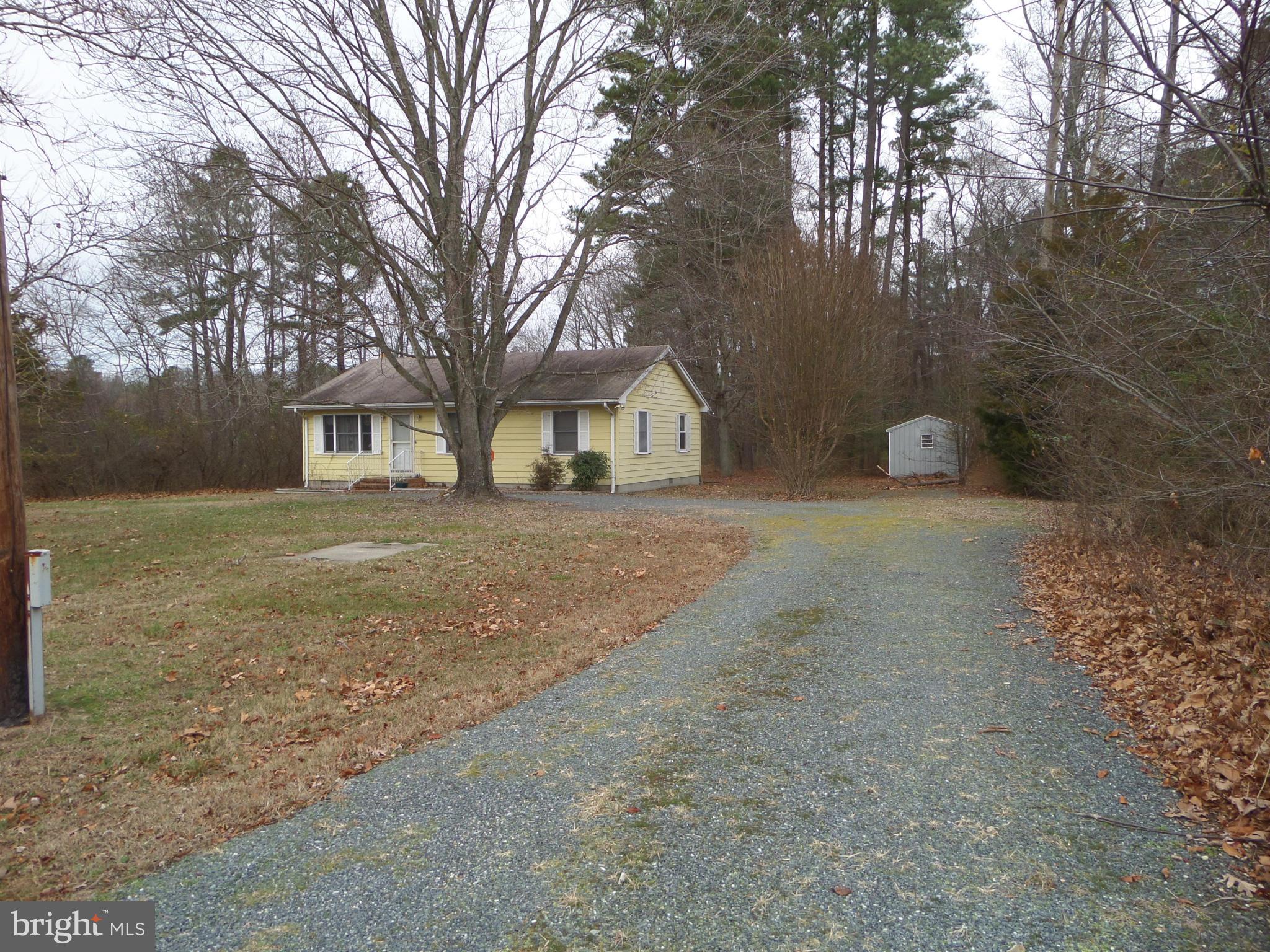 21240 Dover Bridge Road Preston, MD 21655 - Photo 1 of 13 a view of a house with a yard covered in snow