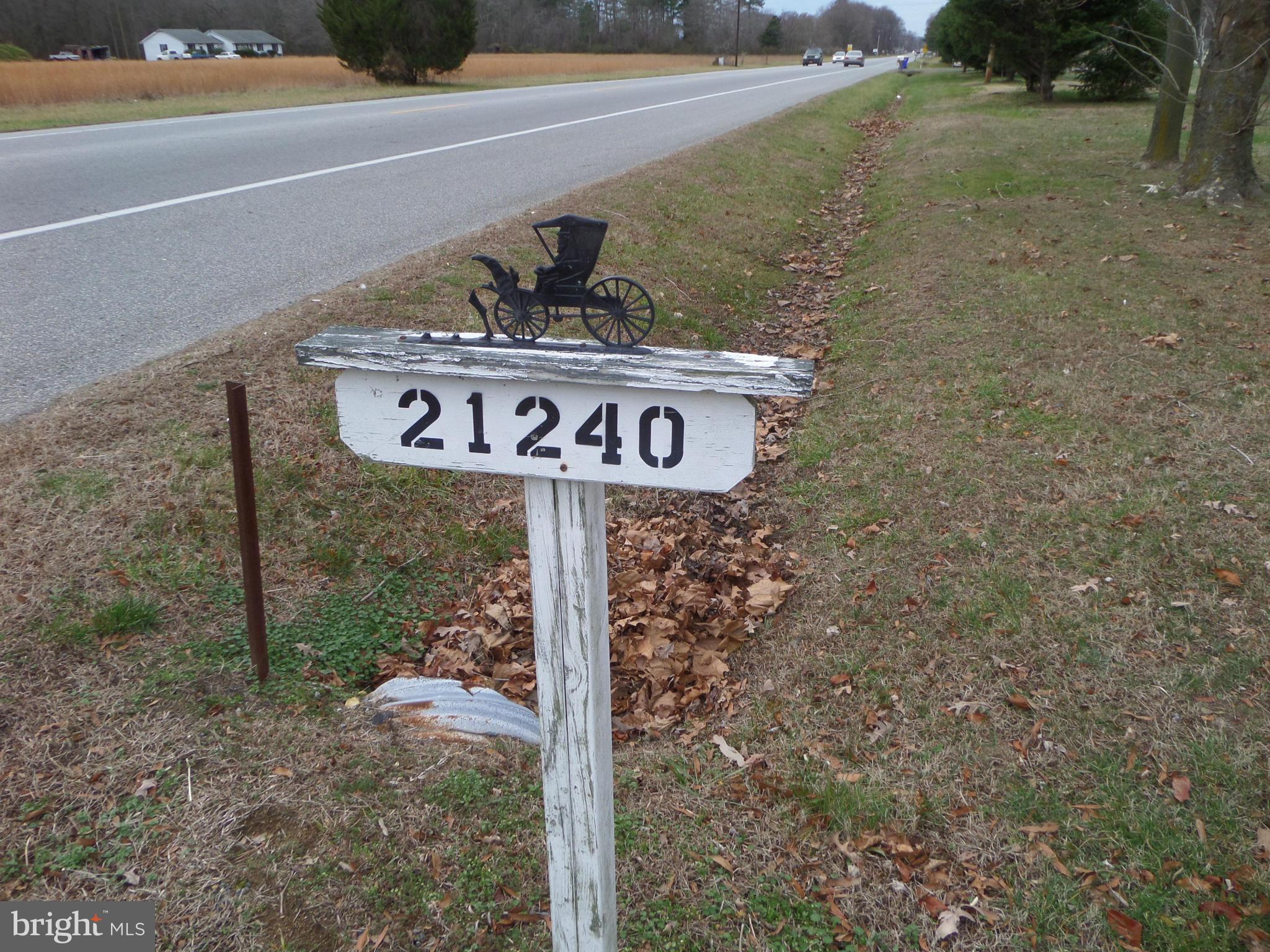21240 Dover Bridge Road Preston, MD 21655 - Photo 3 of 13 a street sign that is on a pole