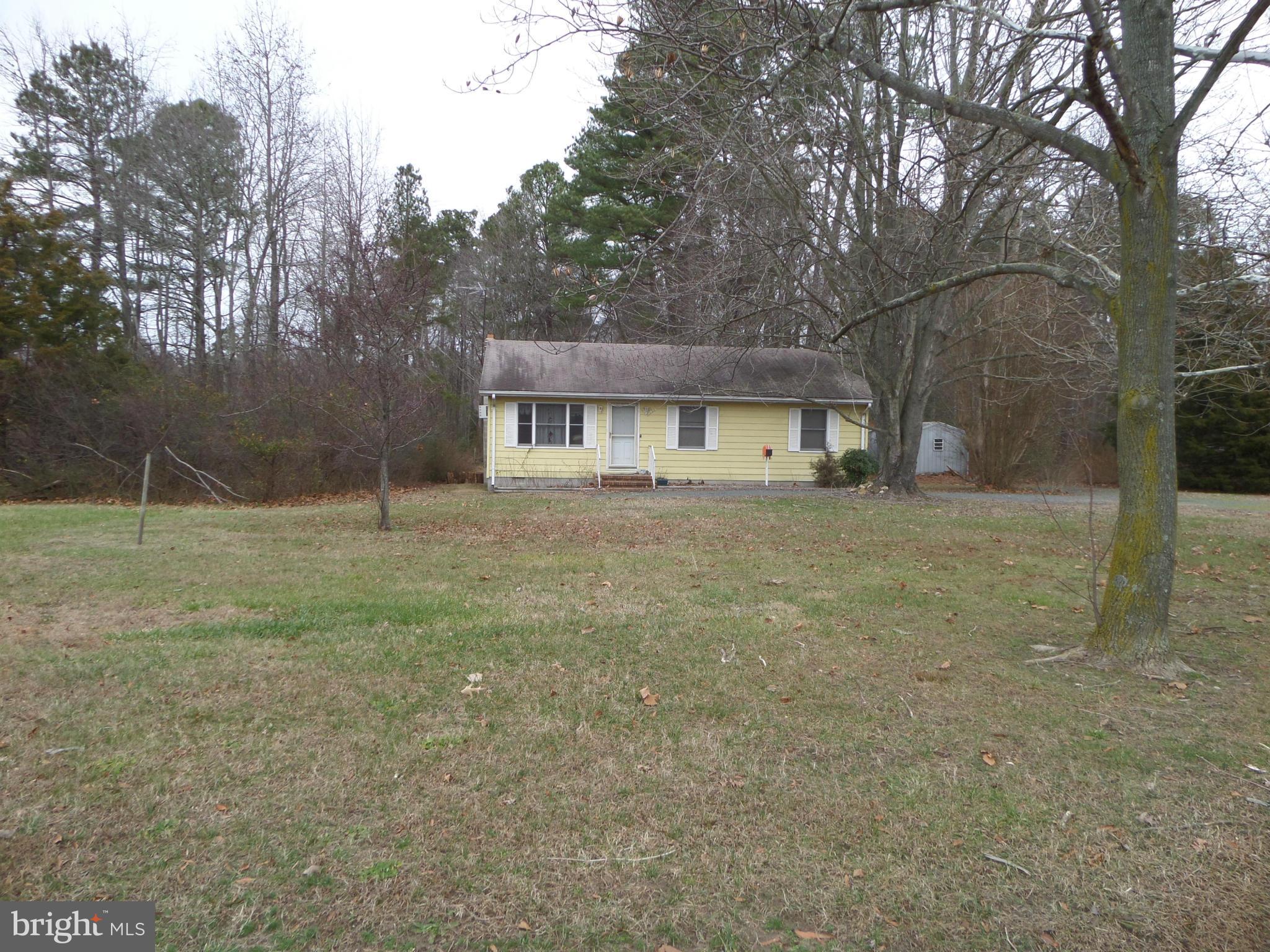 21240 Dover Bridge Road Preston, MD 21655 - Photo 4 of 13 a house view with a garden space