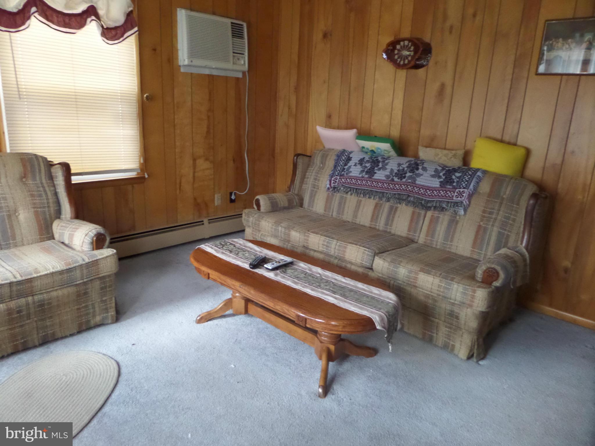 21240 Dover Bridge Road Preston, MD 21655 - Photo 7 of 13 a living room with furniture and a window