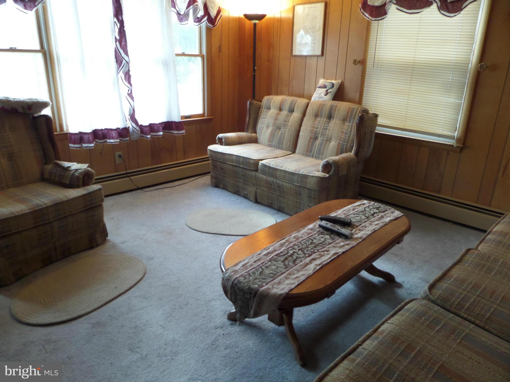 21240 Dover Bridge Road Preston, MD 21655 - Photo 8 of 13 a living room with furniture rug and window