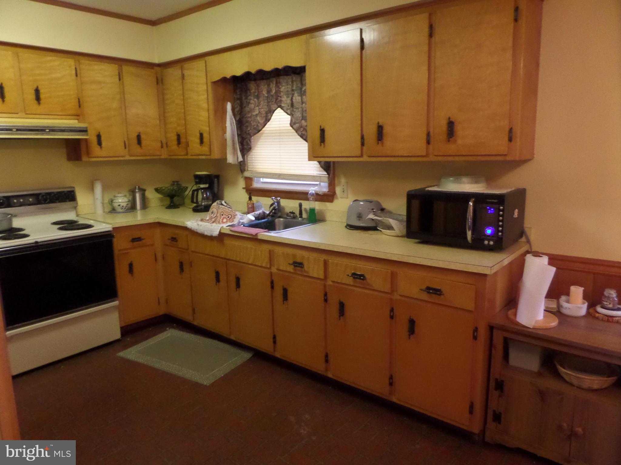 21240 Dover Bridge Road Preston, MD 21655 - Photo 10 of 13 a kitchen with cabinets appliances and a sink