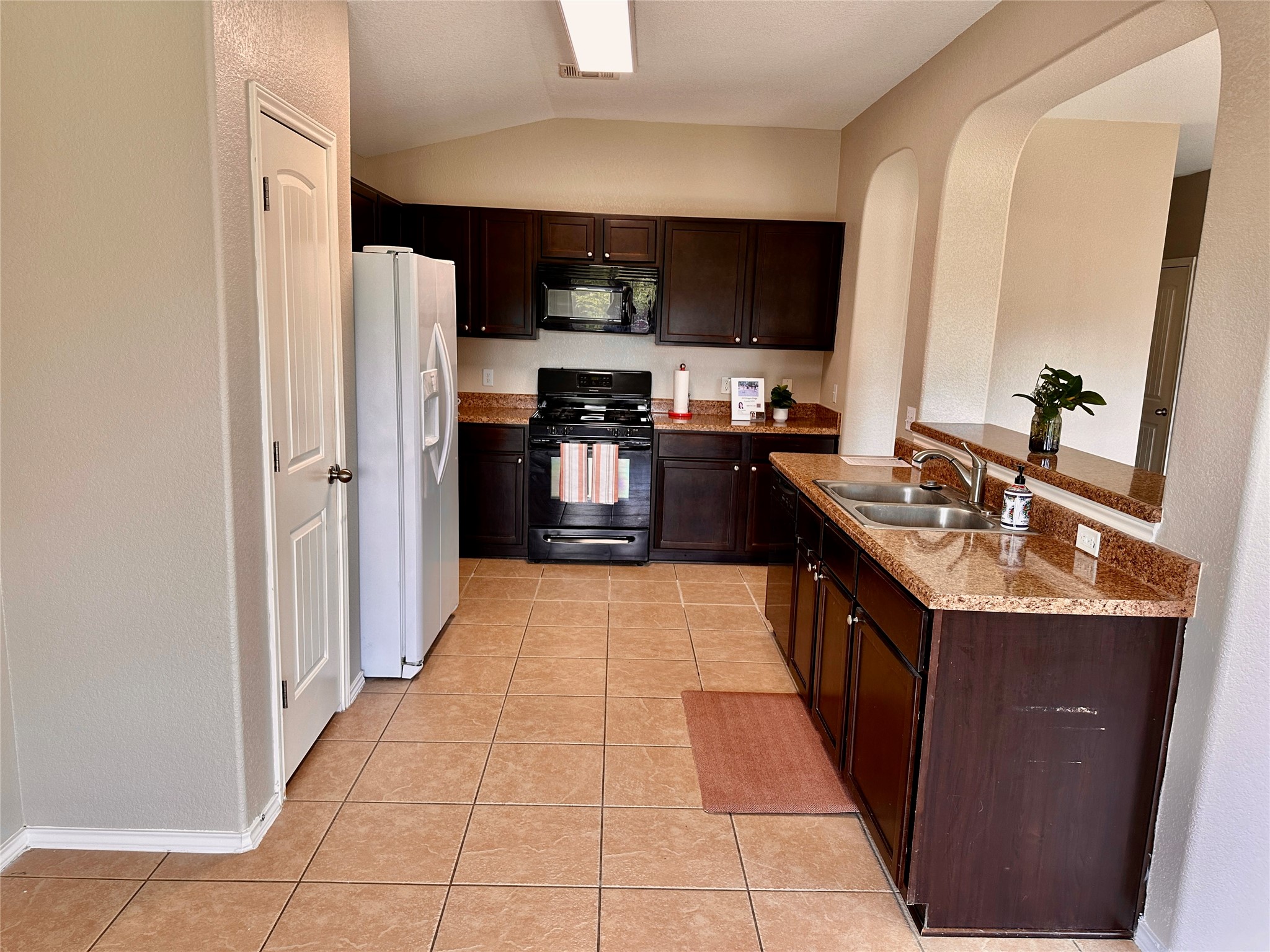 207 Dragon Ridge Road Buda, TX 78610 - Photo 15 of 38 View of the kitchen from the breakfast/dining area